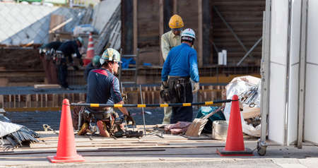 ODAWARA, JAPAN - NOVEMBER, 11, 2017: Builders on a city street. Copy space for textのeditorial素材