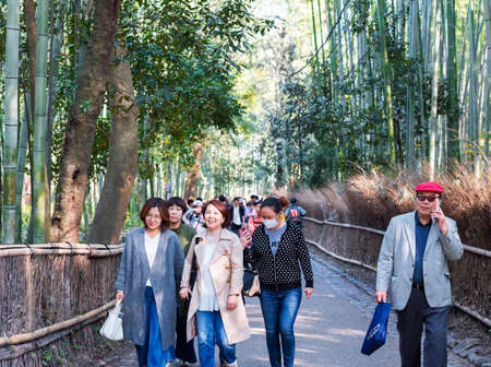 KYOTO, JAPAN - NOVEMBER 7, 2017: People on the road to the bamboo forest, Arashiyamaのeditorial素材