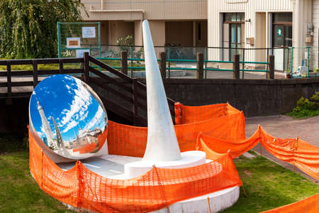 TOKYO, JAPAN Mirror sculpture on a city streetの写真素材