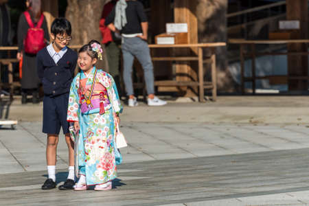 TOKYO, JAPAN - NOVEMBER 7, 2017: A girl and a boy are photographed on the territory of the temple.のeditorial素材