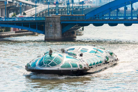 TOKYO, JAPAN - OCTOBER 31, 2017: Pleasure boat on the Sumida river. Copy space for text