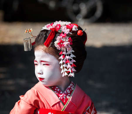 KYOTO, JAPAN - NOVEMBER 7, 2017: Portrait of a little japanese girl in kimono. Close-up.のeditorial素材