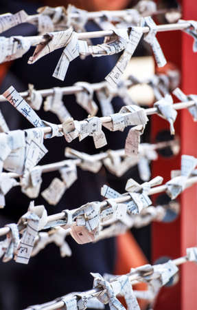 Omikuji-paper strips with random fortunes at Senso-ji temple, Tokyo, Japan.のeditorial素材