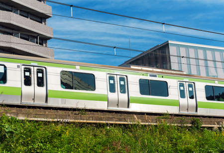 Train on the city's city street, Tokyo, Japan. Copy space for text