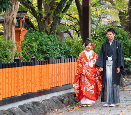 KYOTO, JAPAN - NOVEMBER 7, 2017: Couple in a kimono on a city streetのeditorial素材