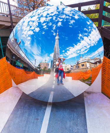 TOKYO, JAPAN - OCTOBER 31, 2017: Mirror sculpture on a city street. Copy space for textのeditorial素材