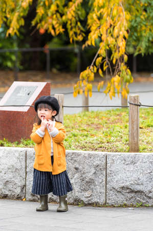 TOKYO, JAPAN - NOVEMBER 7, 2017: Little japanese girl in beret. Vertical.のeditorial素材
