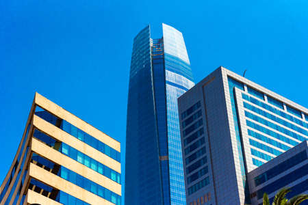 View of the building of Gran Torre Santiago, Santiago, Chile. Isolated on blue background. Copy space for textのeditorial素材