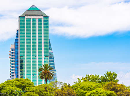 BUENOS AIRES, ARGENTINA - DECEMBER 25, 2017: View of a glass high-rise building against the sky. Copy space for textのeditorial素材