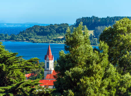 View of the church on the background of the river, Puerto Octay, Chile. Copy space for textの写真素材