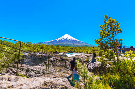 PUERTO VARAS, CHILE - JANUARY 10, 2018: Salutos de Petrohue waterfalls and volcano Osorno. Copy space for textのeditorial素材