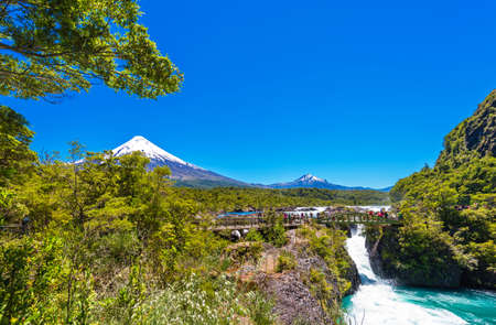 PUERTO VARAS, CHILE - JANUARY 10, 2018: Salutos de Petrohue waterfalls and volcano Osorno. Copy space for textのeditorial素材