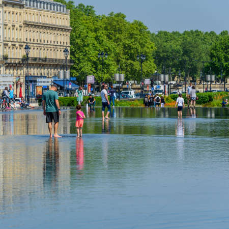 BORDEAUX, FRANCE - MAY 18, 2018: Crowd of people on the Exchange Square, Bordeaux, France. Copy space for textのeditorial素材