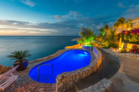 CURACAO, NETHERLANDS - JANUARY 23, 2018: Pool view on the background of the sea in Playa Lagun. Copy space for textのeditorial素材