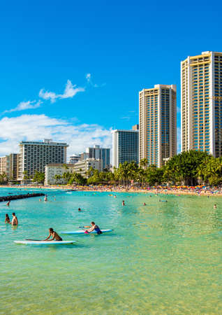 HONOLULU, HAWAII - FEBRUARY 16, 2018: View of the sandy city beach. Copy space for text. Verticalのeditorial素材