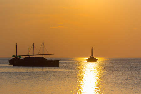 Boats on sunset background, Maldives. Copy space for textの写真素材