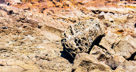 View of the rocks on the beach Papakolea (green sand beach), Hawaii, USA. With selective focusの写真素材