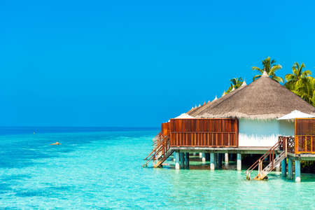 Water villa in a row by the seashore, Maldives. Copy space for textの写真素材