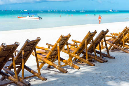 Bamboo chairs on the beach, Boracay, Philippines. With selective focus
