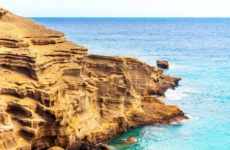 View of the rocks on the beach Papakolea (green sand beach), Hawaii, USAの写真素材