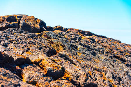 View of the rocks on the beach Papakolea (green sand beach), Hawaii, USA. With selective focusの写真素材