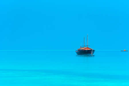 Boat off the coast of the island, Maldives. Copy space for text
