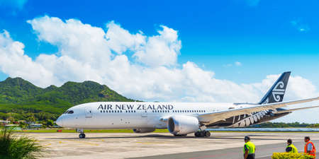 ARUTANGA, AITUTAKI, COOK ISLAND - SEPTEMBER 30, 2018: Airplane at the landscape mountain landscape....