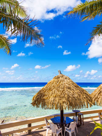 View of the cafe by the ocean, Cook Islands, South Pacific. With selective focus. Vertical