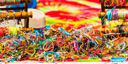 Multi-colored bracelets in the local market, Rarotonga, Aitutaki, Cook Islands. With selective focus