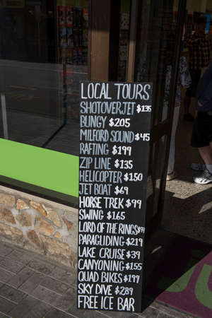 QUEENSTOWN, NEW ZEALAND - OCTOBER 10, 2018: Local tour advertising. Verticalのeditorial素材