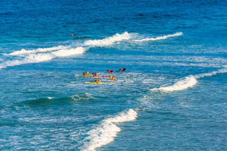 QUEENSLAND, AUSTRALIA - OCTOBER 23, 2018: Group of people on a surf, Gold Coastのeditorial素材