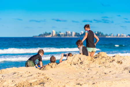 QUEENSLAND, AUSTRALIA - OCTOBER 23, 2018: People on the sandy beach, Gold Coastのeditorial素材