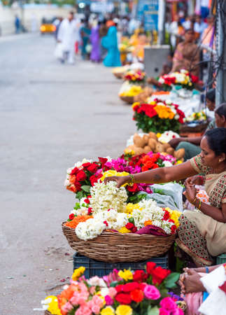 PUTTAPARTHI, INDIA - NOVEMBER 29, 2018: Bouquets of flowers in the local market. Verticalのeditorial素材
