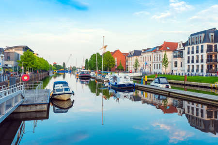 OLDENBURG, GERMANY - MAY 24, 2019: Boats drop anchor in a havenのeditorial素材