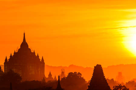 Bagan, Myanmar temples in the Archaeological Park, Burma. Sunrise, green trees.の写真素材
