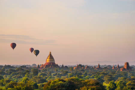 Bagan, Myanmar temples in the Archaeological Park, Burma. Sunrise, green trees.の写真素材