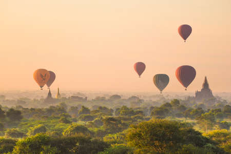 Bagan, Myanmar temples in the Archaeological Park, Burma. Sunrise, green trees.の写真素材