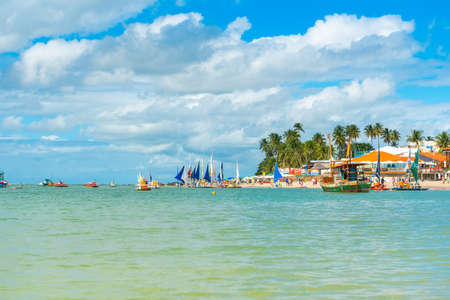 IPOJUCA, BRAZIL - JUNE 18, 2019: View of the sandy beach of Porto de Galinhas. Copy space for textのeditorial素材