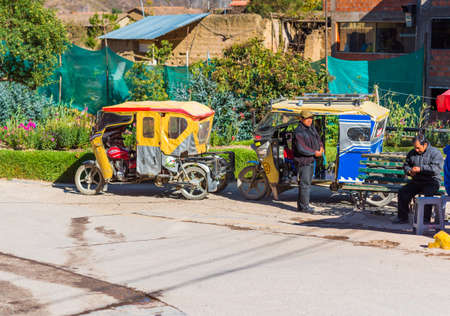 OLLANTAYTAMBO, PERU - JUNE 26, 2019: Transport tuk-tuk on a city streetのeditorial素材