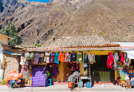 OLLANTAYTAMBO, PERU - JUNE 26, 2019: Colourful goods for sale in souvenir shopのeditorial素材