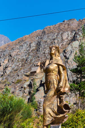 Golden Inca statue, Ollantaytambo, Peru. With selective focus. Verticalのeditorial素材