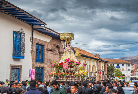 CUSCO, PERU - JUNE 26, 2019: Men carry a sculpture of a saint, San Cristobal Celebracion