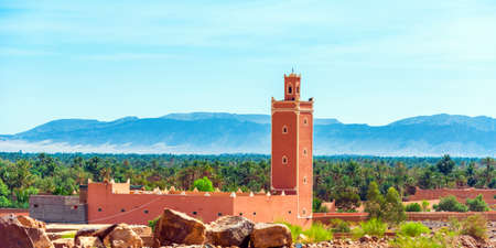 Mosque against the backdrop of a mountain landscape, Zagora, Morocco.の写真素材