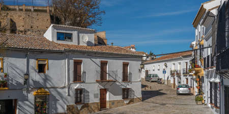 Ronda, Spain - January 8, 2020: View of buildings on a city street on a sunny day, Province Malaga,...