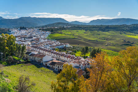 View of the mountain landscape and city buildings from above, Ronda, Province Malaga, Andalusia, Spainの写真素材