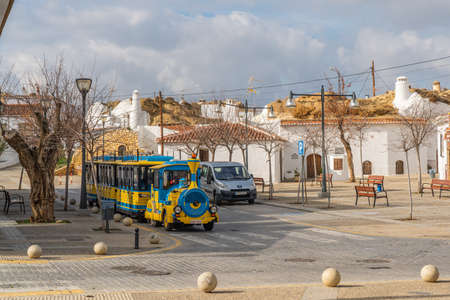 Guadix, Spain - January 10, 2020: Tourist road train on a city street, province Granada, Andalusiaのeditorial素材