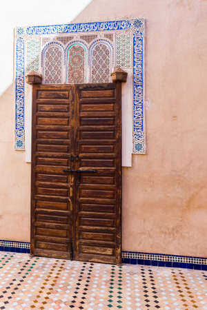 Marrakesh, Morocco - November 6, 2019: Traditional arabic door in Bahia Palace. Verticalのeditorial素材
