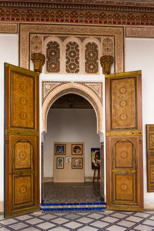 Marrakesh, Morocco - November 6, 2019: Traditional arabic door in Bahia Palace. Verticalのeditorial素材
