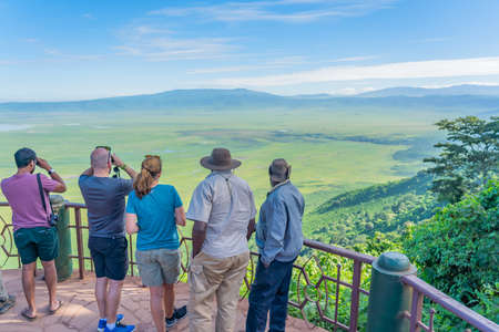 Tourist looks into the Ngorongoro crater National Park with the Lake Magadi from the look out.  Beautiful landscape scenery in Tanzania, Africaのeditorial素材