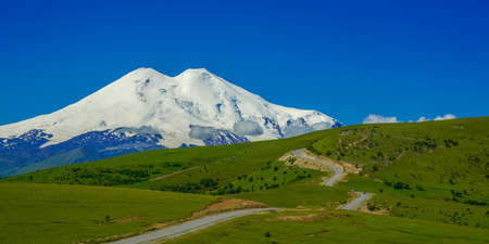Panorama Road Leading at Hills to Mount Elbrusの写真素材